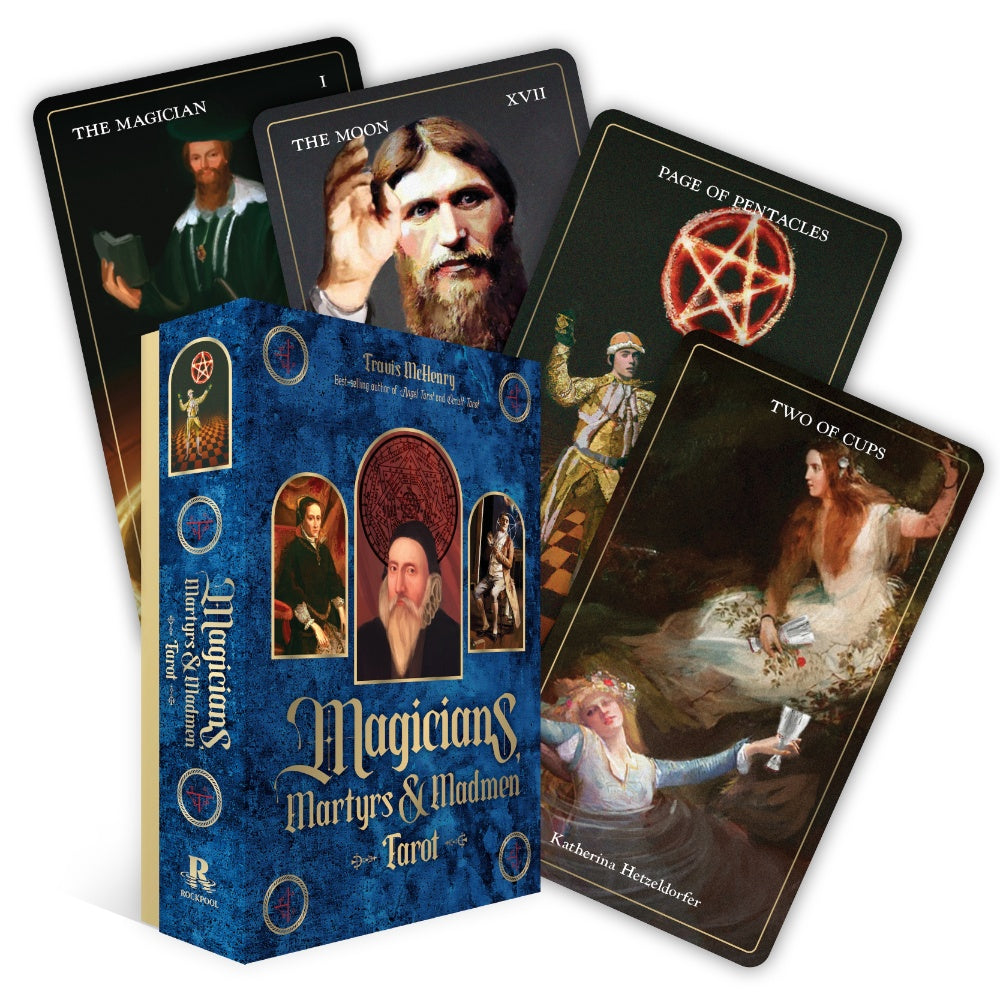 Collection of tarot cards with a blue box labeled 'Magicians Martyrs & Madmen Tarot' on a white background.