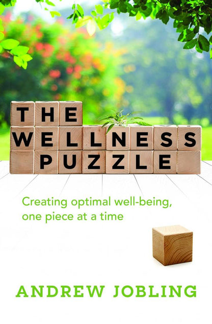 Book cover of 'The Wellness Puzzle' By Andrew Jobling with wooden blocks spelling out the title against a natural background.