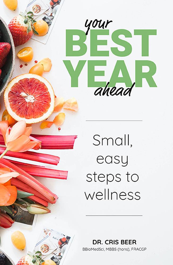 Book cover of 'Your Best Year Ahead' with fruits and flowers on a white background