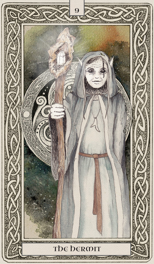 Tarot card featuring a figure labeled 'The Hermit' with intricate border design.
