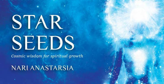 Book cover of 'Star Seeds' with a blue background and person holding light