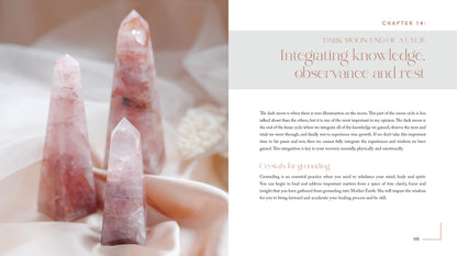 Close-up of pink crystal points held in hands with a text page on integrating knowledge, observance, and rest.
