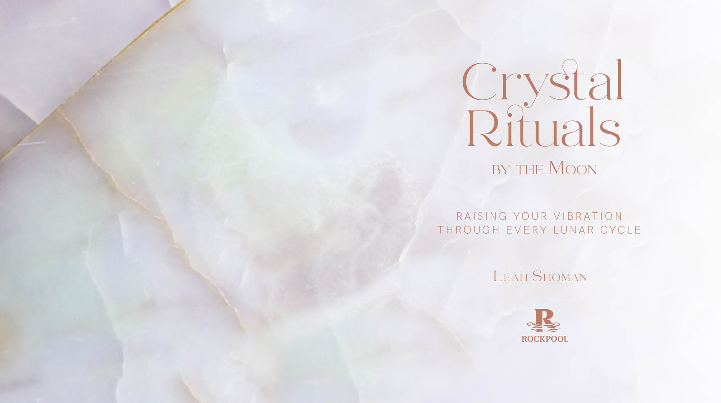 Book cover of 'Crystal Rituals by the Moon' with a soft, blurred background.