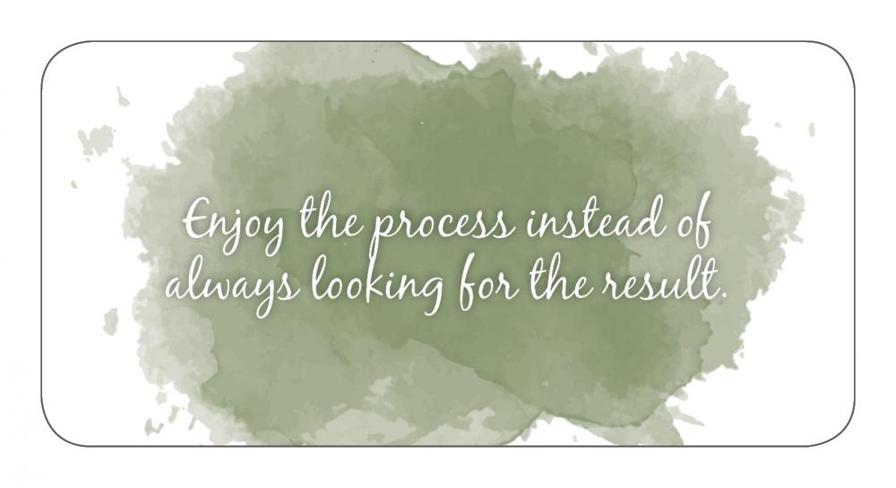 Motivational quote on a watercolor background with a green splash.