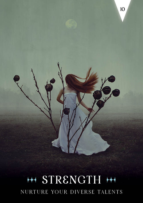 Woman in a white dress standing between two branches with dark fruits, against a misty background.