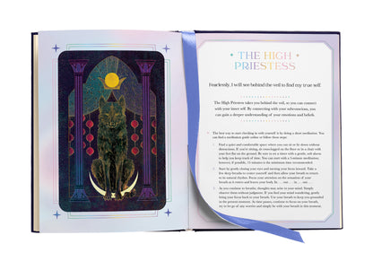 Open book showing a tarot card with a wolf and text on a white background