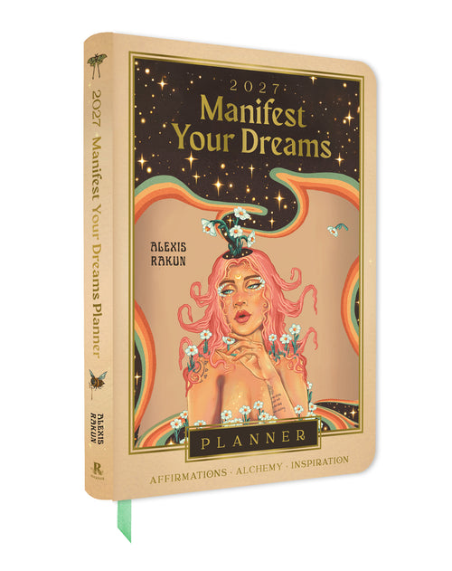 Planner cover of Manifest Your Dreams 2027 design featuring a woman's face, pink hair, and celestial elements with text 'Manifest Your Dreams' on a white background.